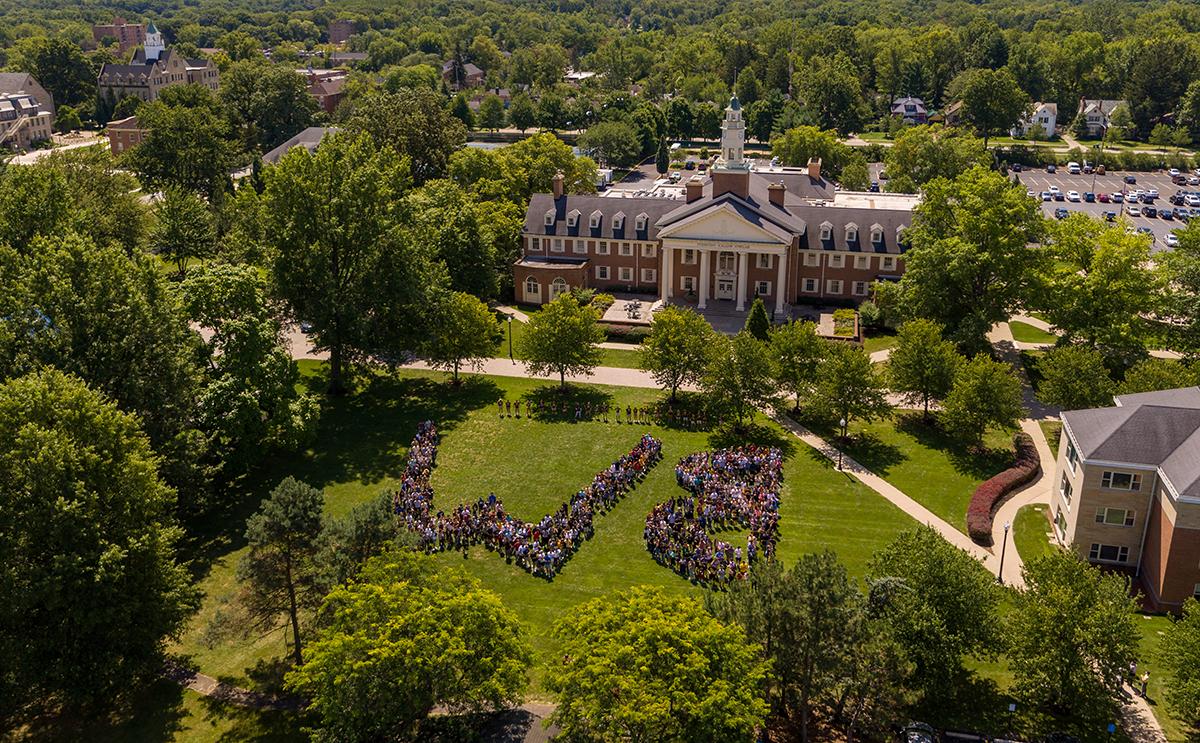 Aerial of students spelling out BW in front of Strosacker Hall